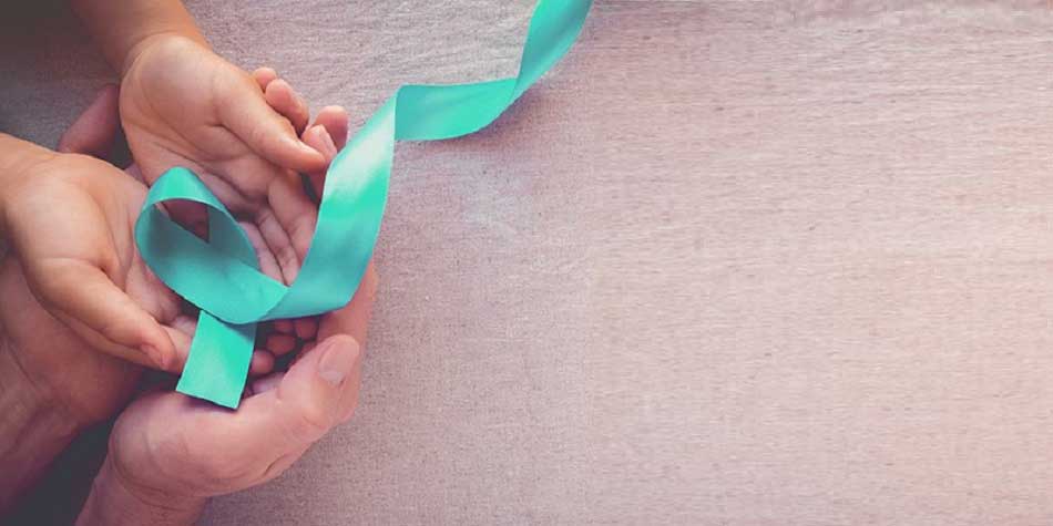Green ribbon in woman's hands