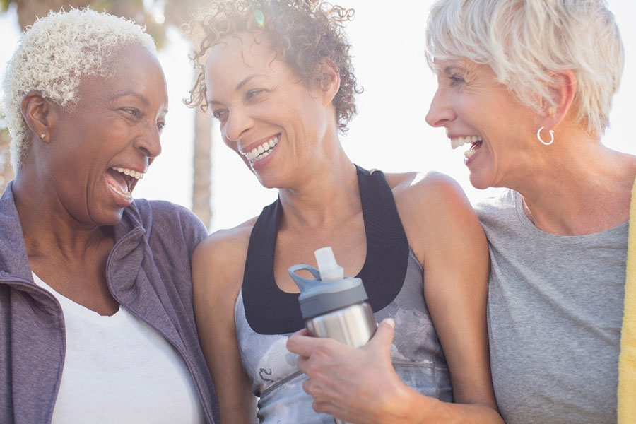 Three female seniors laugh together